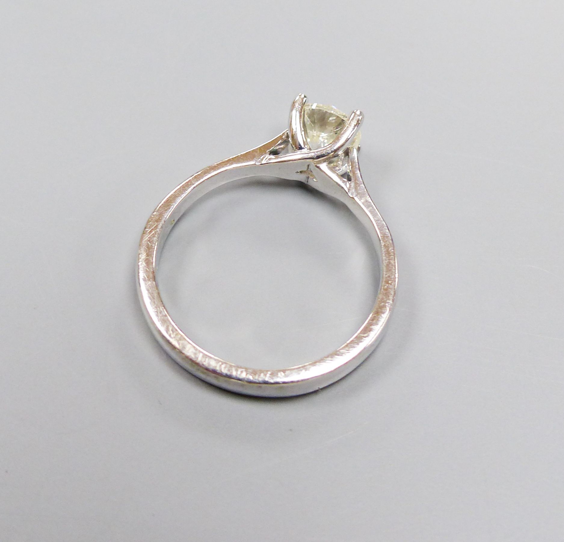 A modern white gold and solitaire diamond ring, size N, gross weight 4.6 grams